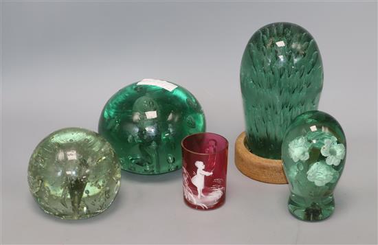 Four glass dump weights and a Mary Gregory glass mug